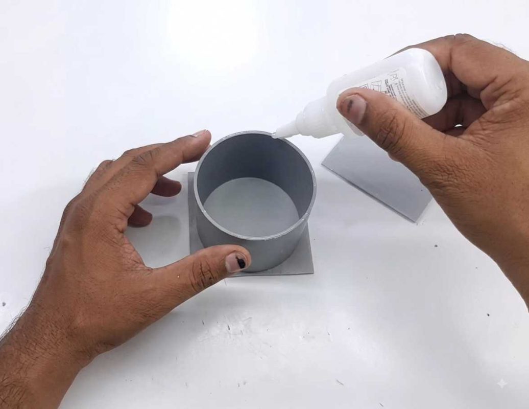Applying fast-setting glue to PVC pipe and sheet