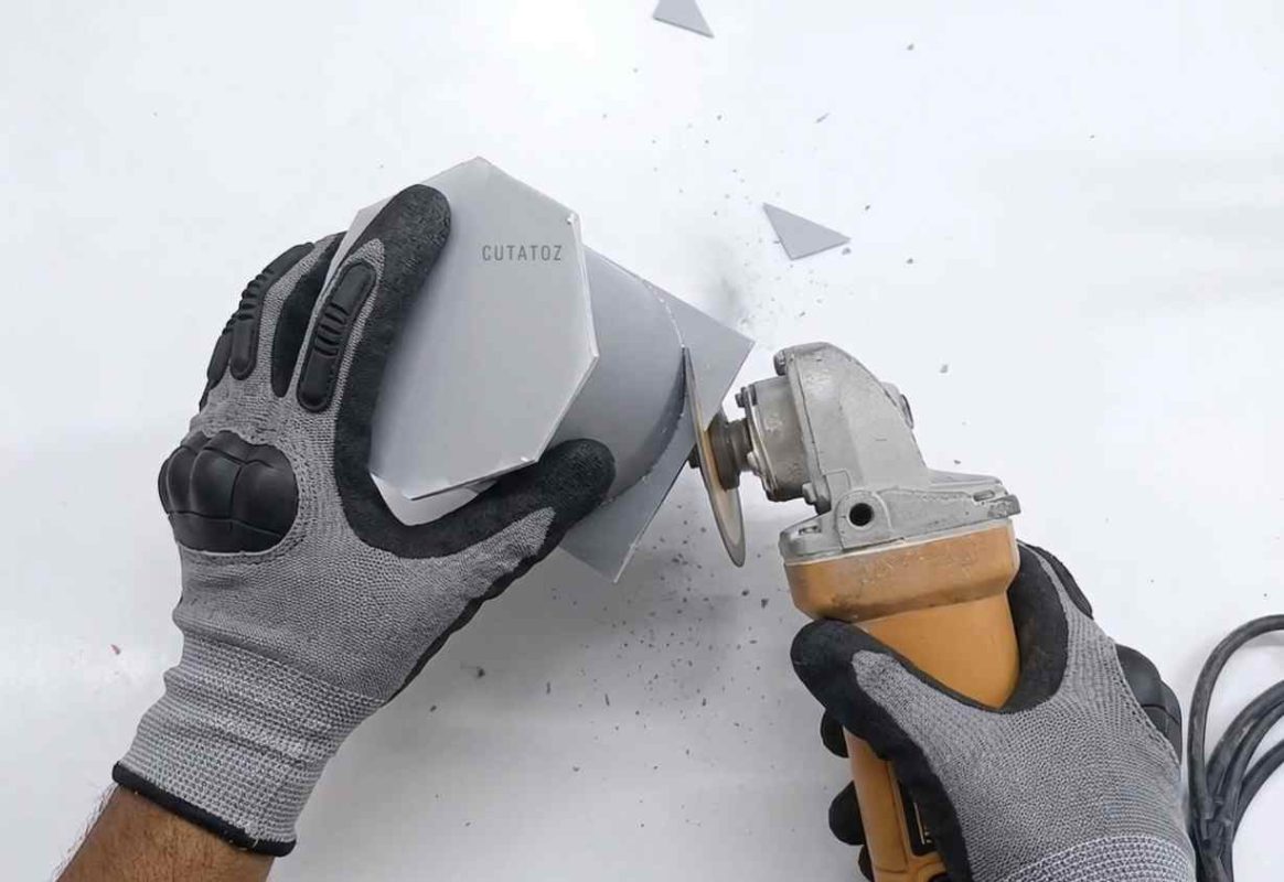 Cutting and smoothing excess PVC sheet with an angle grinder